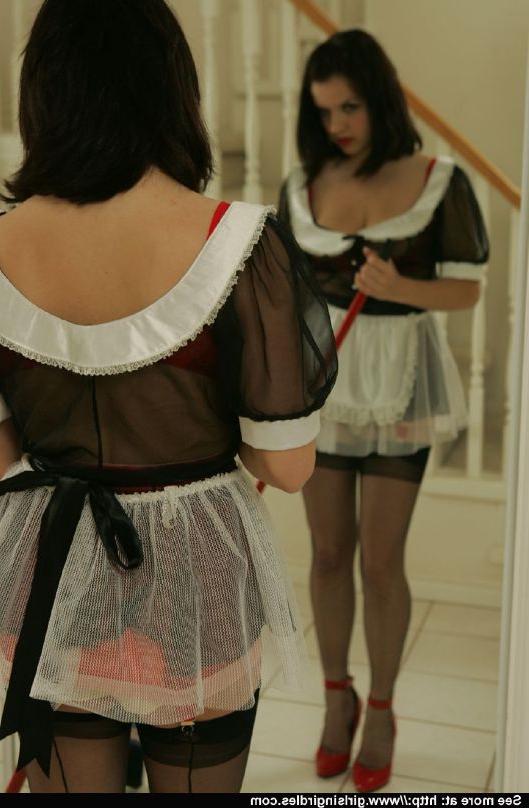 12P Brunette babe in stockings and maid uniform posing in front of the mirror