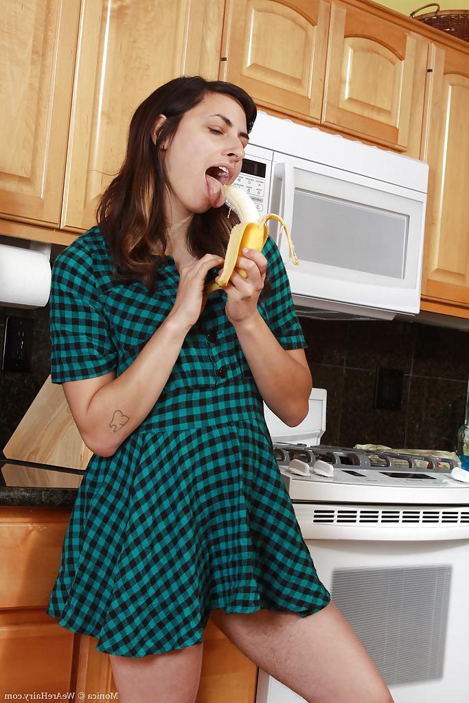 16P Lusty babe Monica stripping and masturbating her cunt in the kitchen
