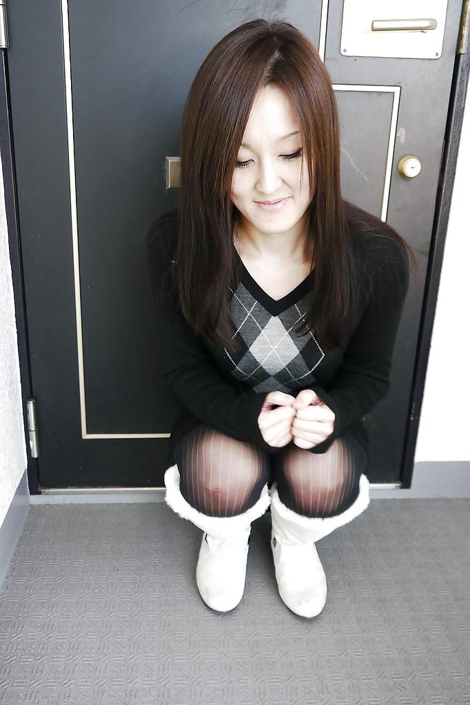 16P Asian brunette Riko Kariya posing for non nude shots in boots and hose