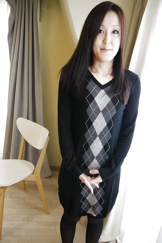 16P Asian brunette Riko Kariya posing for non nude shots in boots and hose