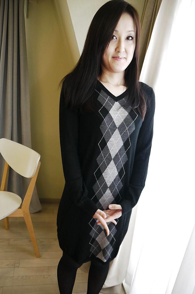 16P Asian brunette Riko Kariya posing for non nude shots in boots and hose