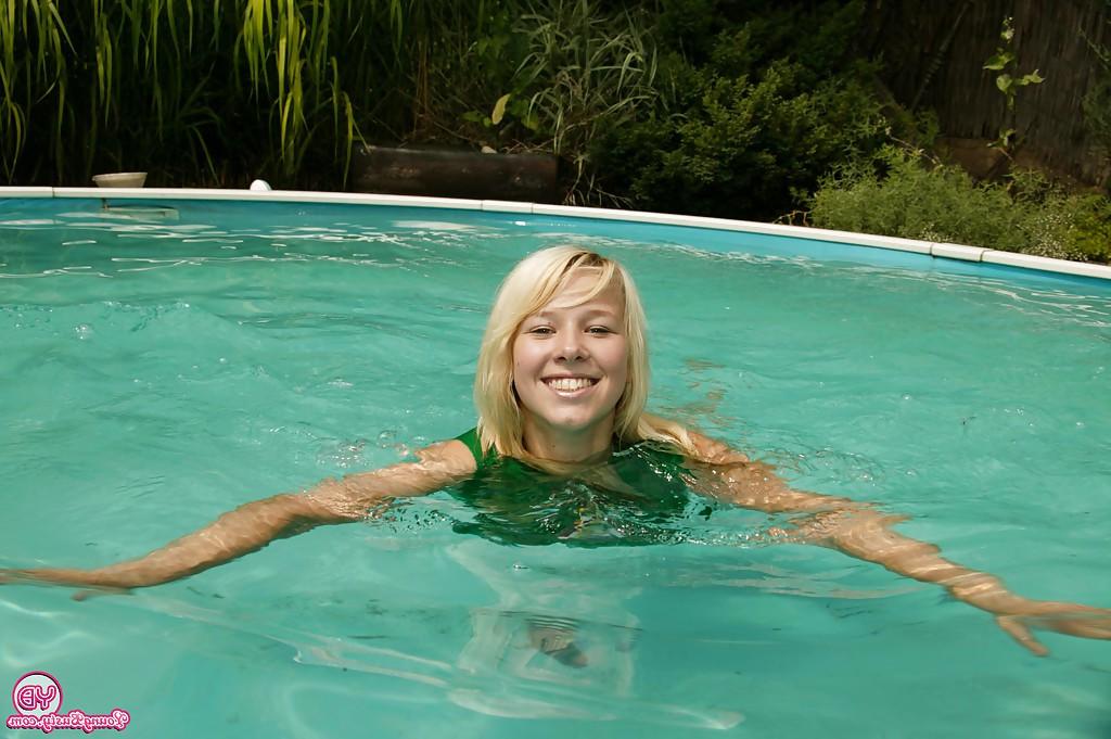 16P Masturbating teen babe Kessy Ros caught on camera outdoor at the pool