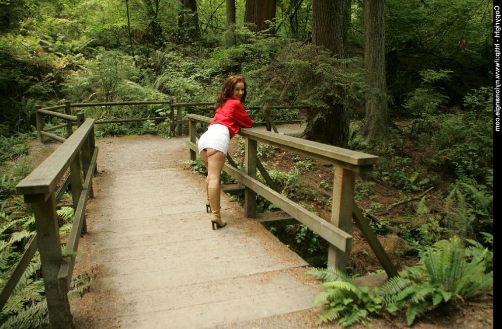 12P Gorgeous mature babe in stockings lifting up her skirt in public