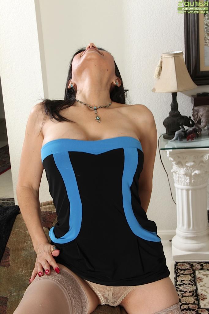 16P Mature brunette Marcy Darling shows off her big tits in close up