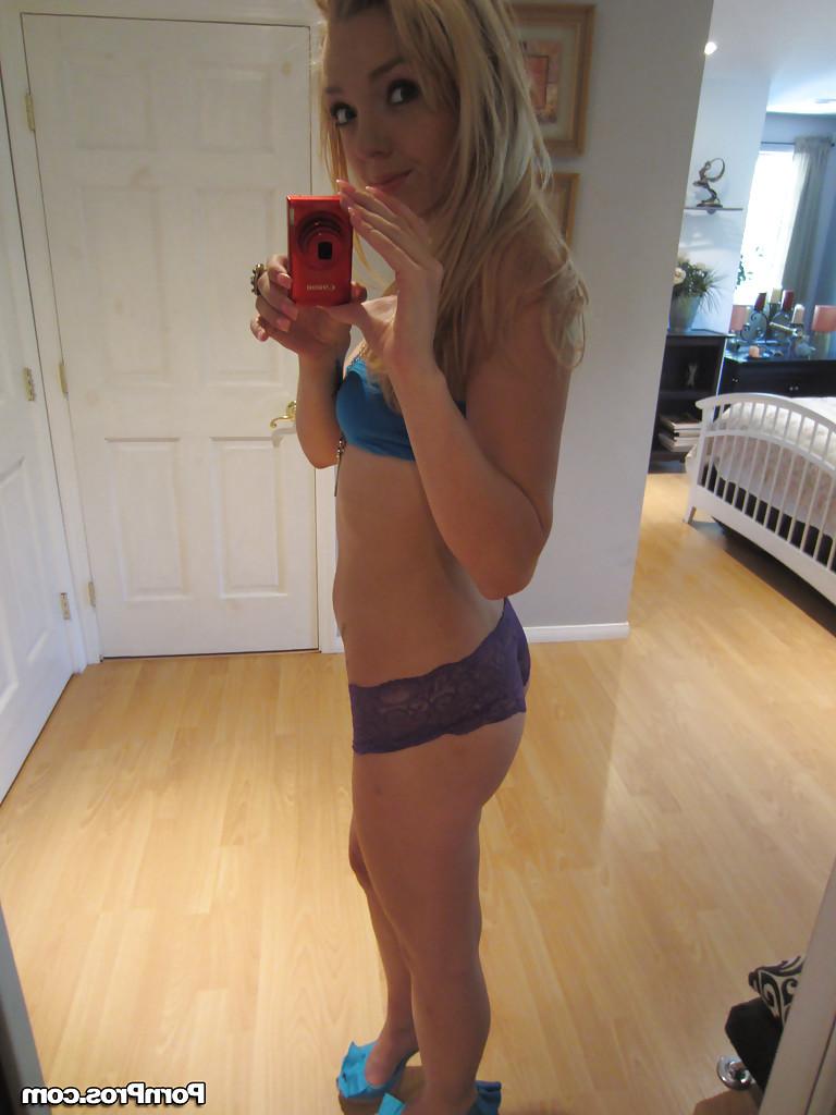 16P Ally Winters is spreading her slim legs wide open while masturbating