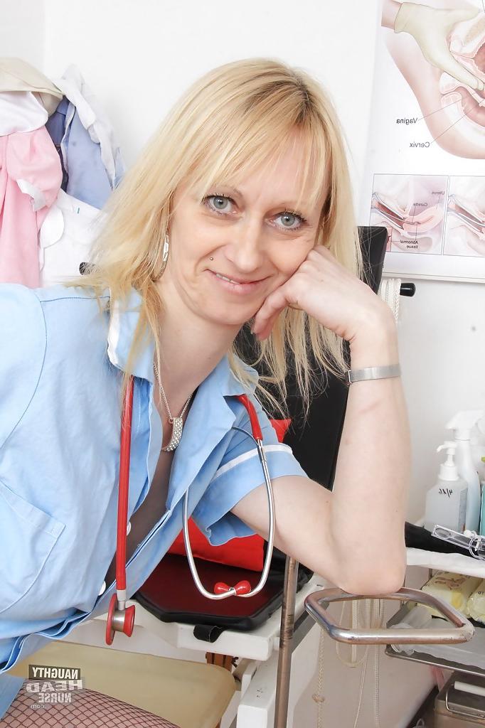 16P Mature nurse Nelly stripping off uniform and masturbating shaved pussy