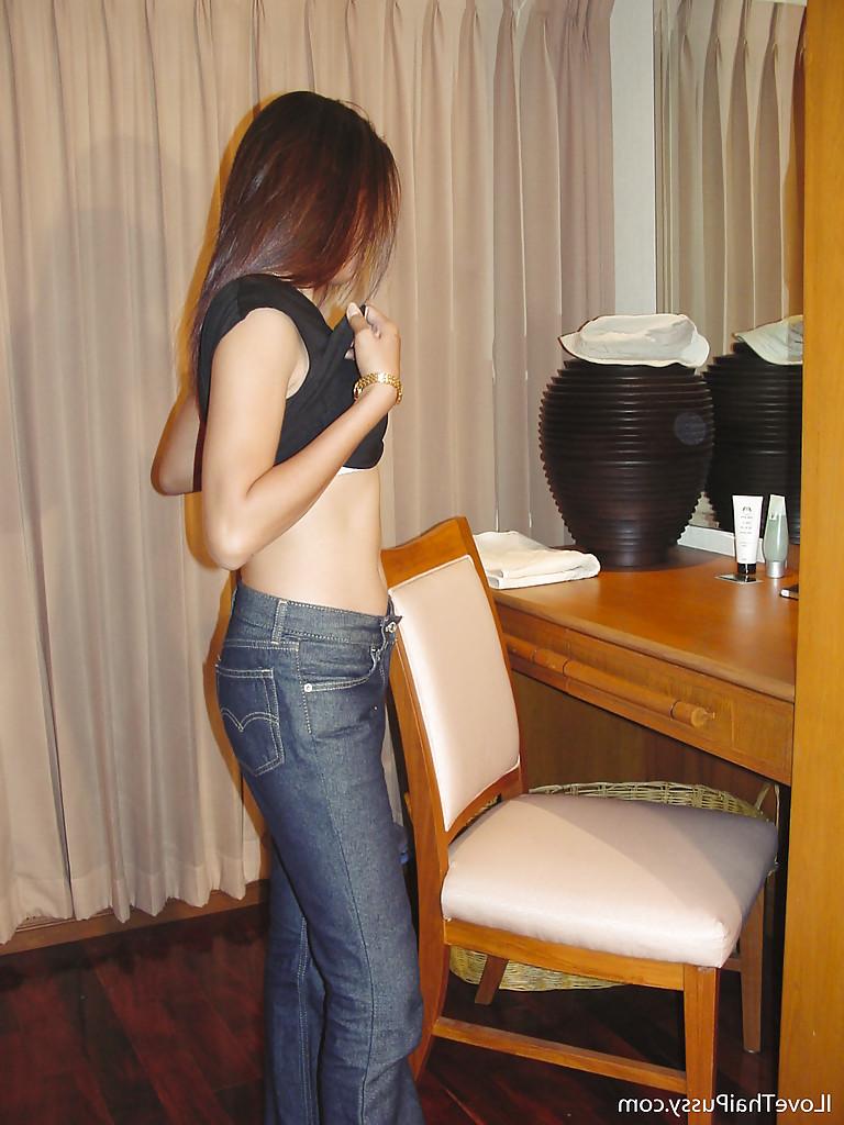 16P Horny asian babe slipping off her clothes and masturbating her hairy pussy