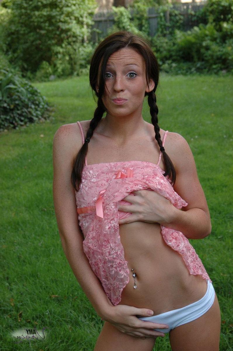 20P Pictures of teen Amy Virgin goofing off in the back yard
