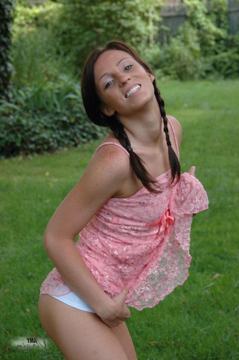 20P Pictures of teen Amy Virgin goofing off in the back yard