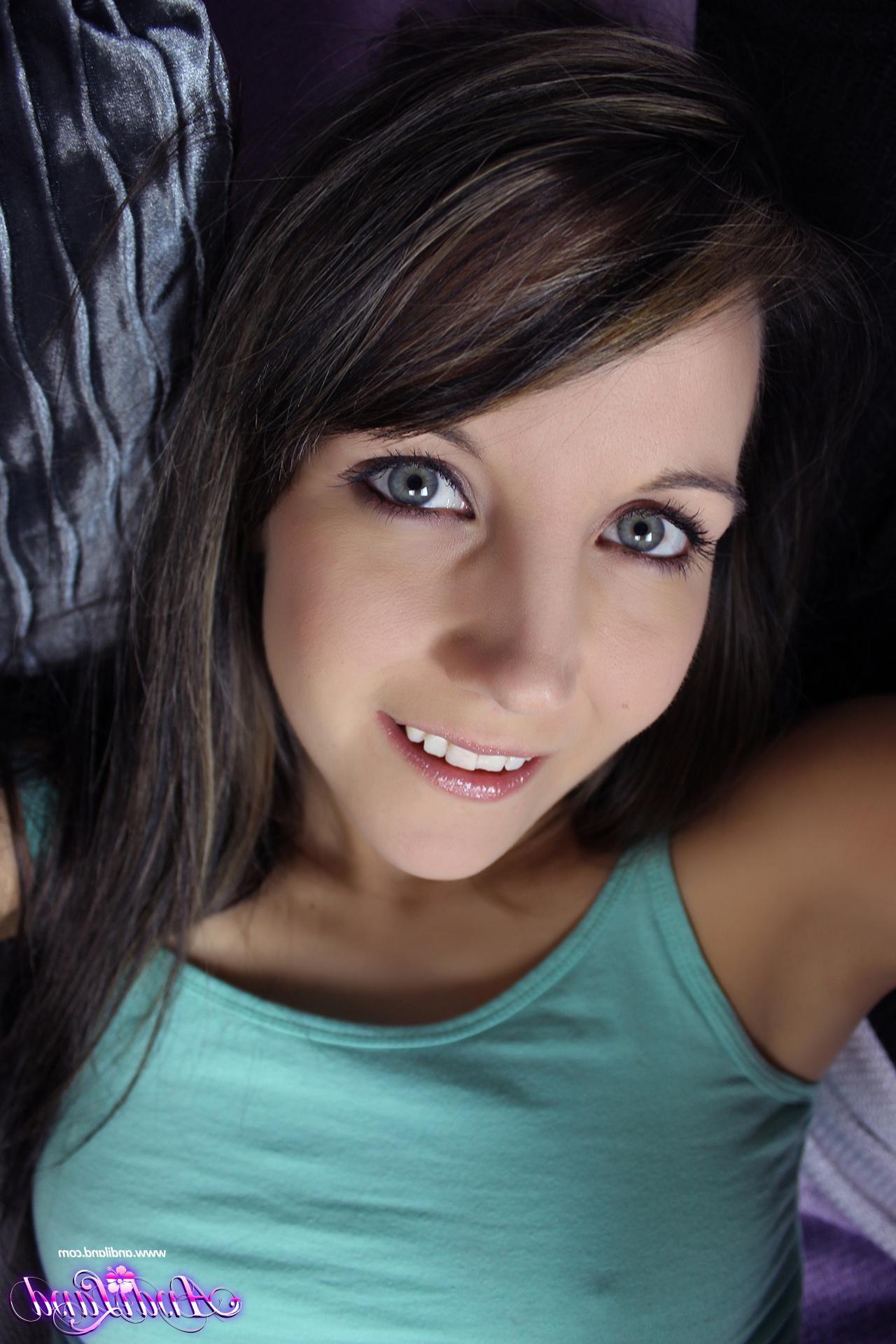 15P Brunette teen Andi Land teases in her slippers and cardigan
