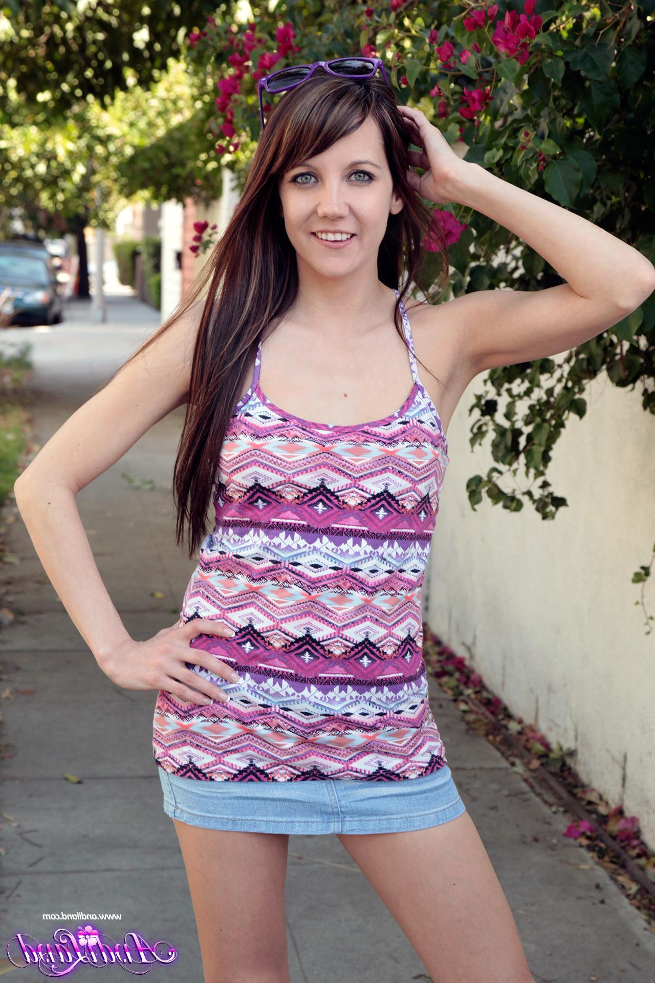 15P Andi Land flashes her perky tits and tight pussy for you outside