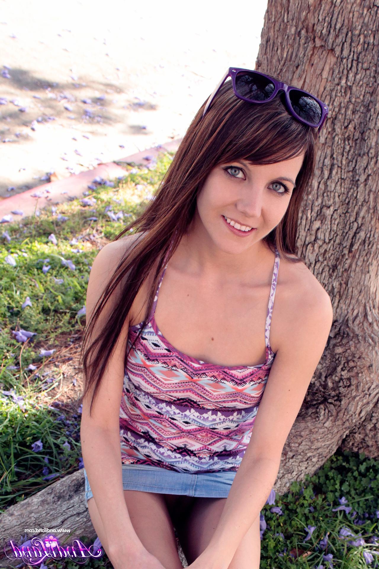 15P Andi Land flashes her perky tits and tight pussy for you outside