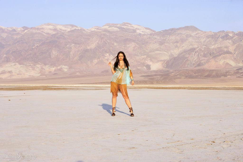16P Busty babe Aria Giovanni shows off her boobs in the desert