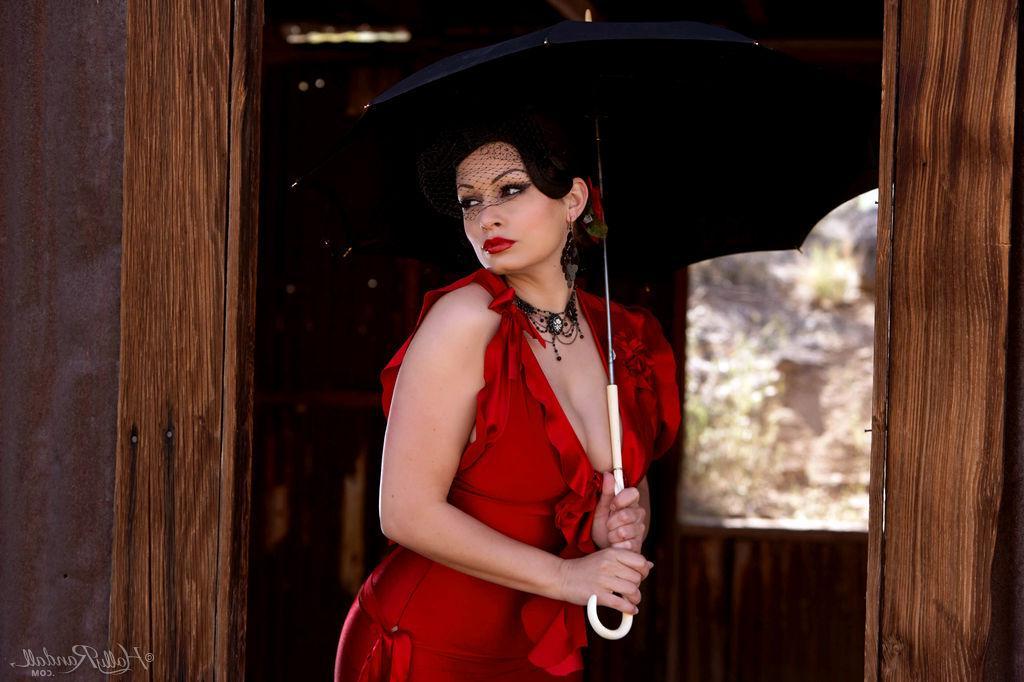 16P Busty pinup star Aria Giovanni exposes her boobs in a red dress