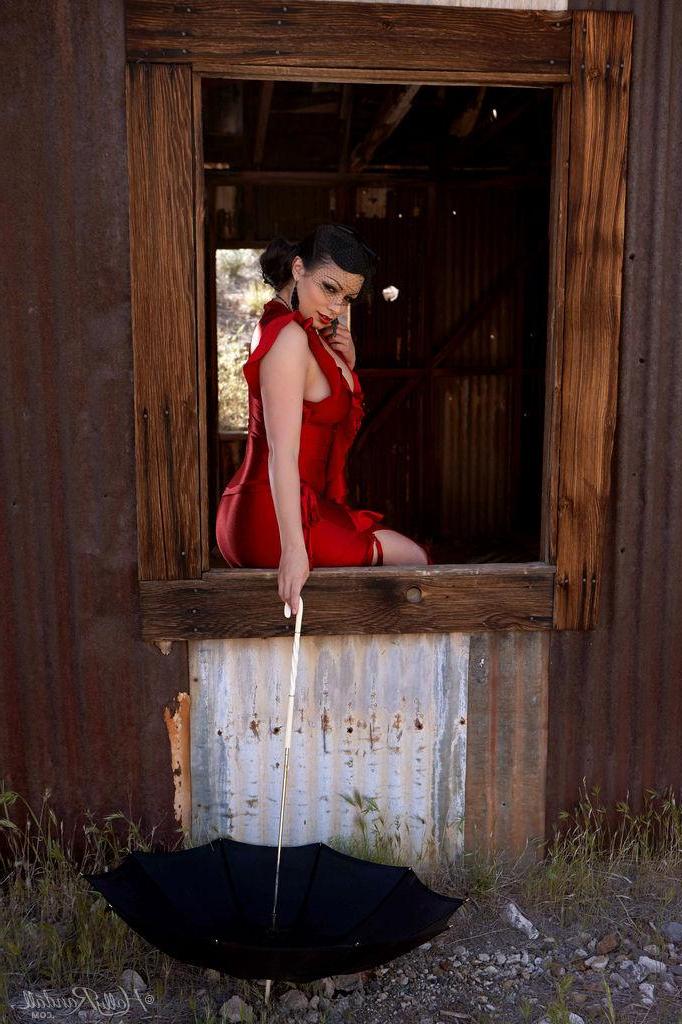 16P Busty pinup star Aria Giovanni exposes her boobs in a red dress