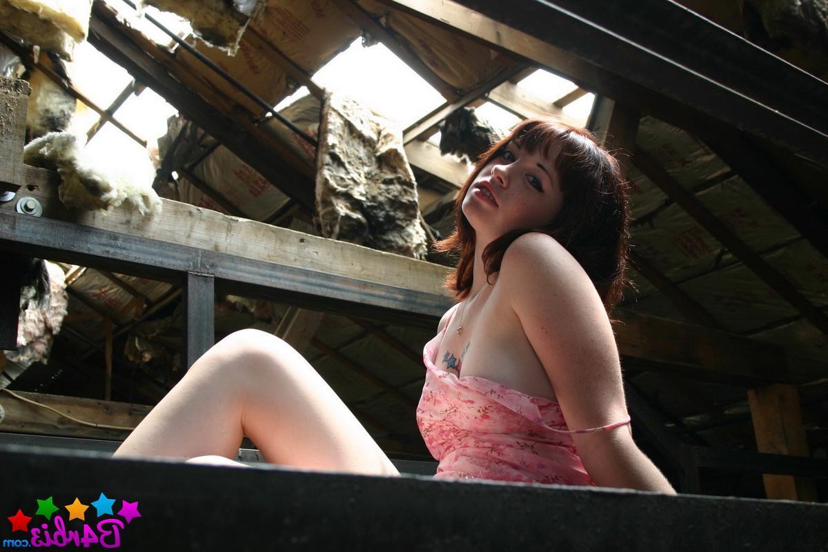 12P Sexy tease Barbie shows off her perky boobs as she strips in an abandoned building
