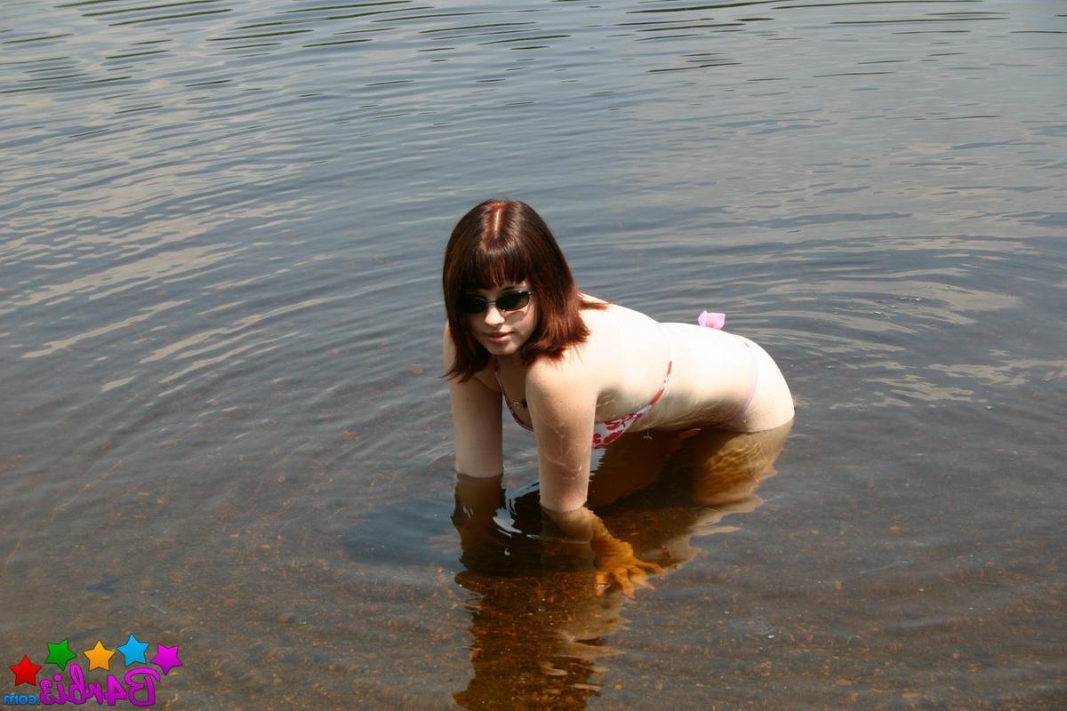 12P Stunning perky tease Barbie gets naked as she goes skinny dipping at the public beach