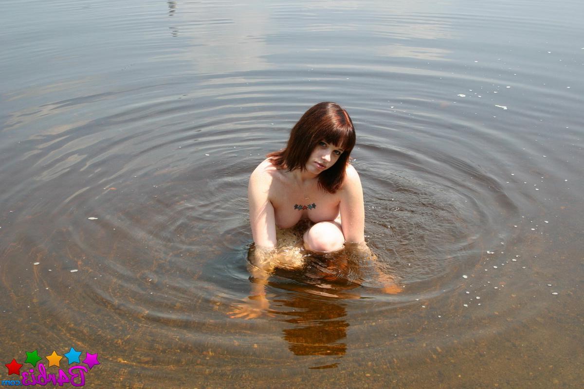12P Stunning perky tease Barbie gets naked as she goes skinny dipping at the public beach