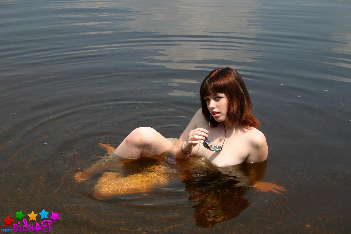 12P Stunning perky tease Barbie gets naked as she goes skinny dipping at the public beach