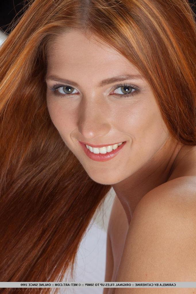 18P Redhead beauty Carinela spreads her legs for you in bed