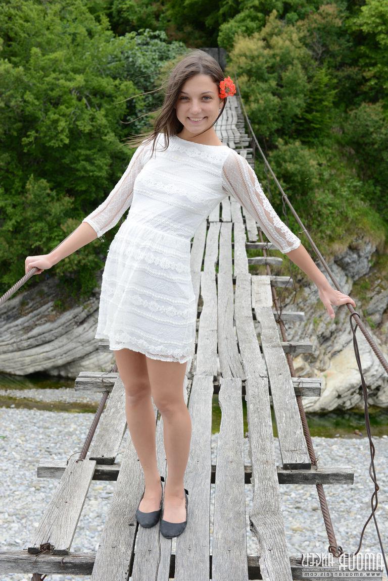 20P Brunette teen Nensi strips naked for you on the beach