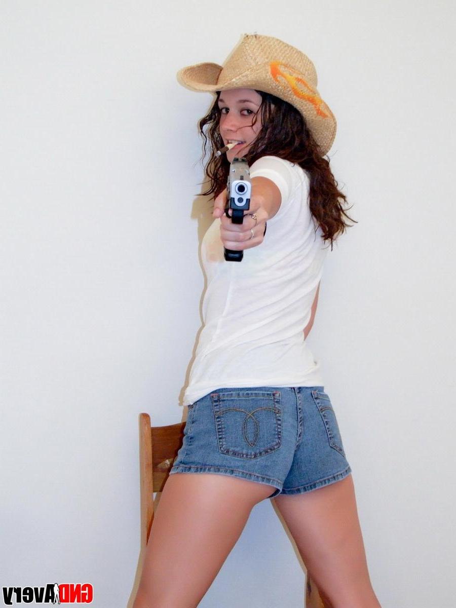 12P Sexy cowgirl Avery shows off her perky teenage tits as she strips naked holding a gun