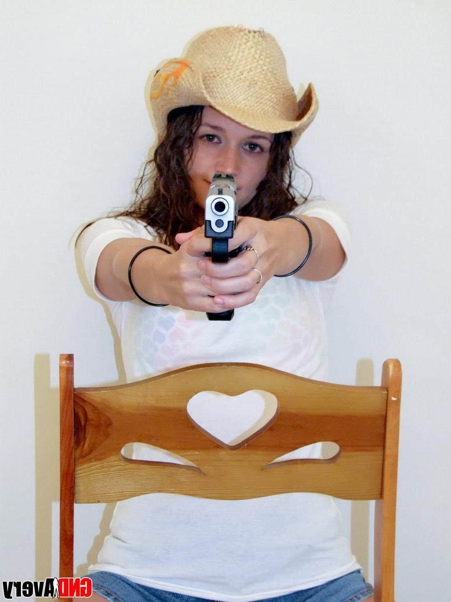 12P Sexy cowgirl Avery shows off her perky teenage tits as she strips naked holding a gun