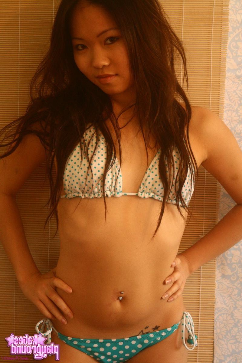 12P Grace loves to tease with her perky body in a skimpy string bikini
