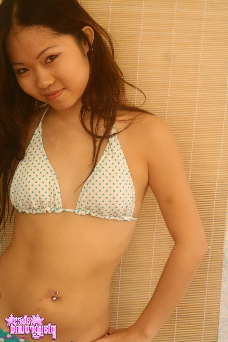 12P Grace loves to tease with her perky body in a skimpy string bikini