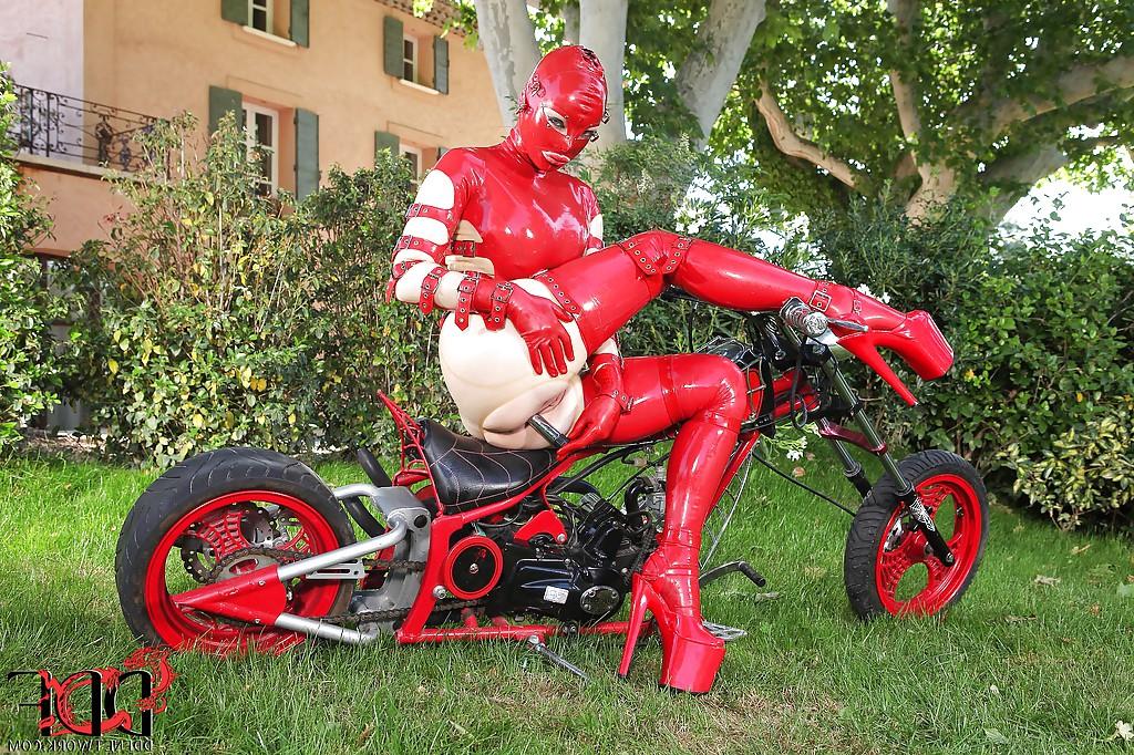 16P Hot fetish seductress in latex suit and mask toying her pussy outdoor
