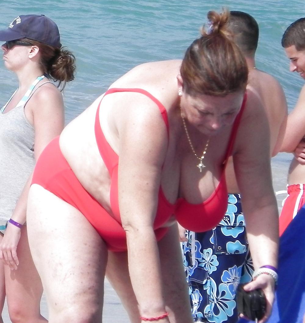 25P Mature boobs beach