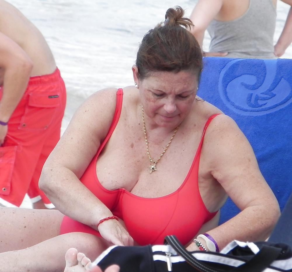 25P Mature boobs beach