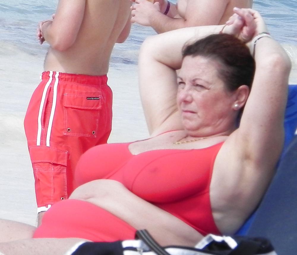 25P Mature boobs beach
