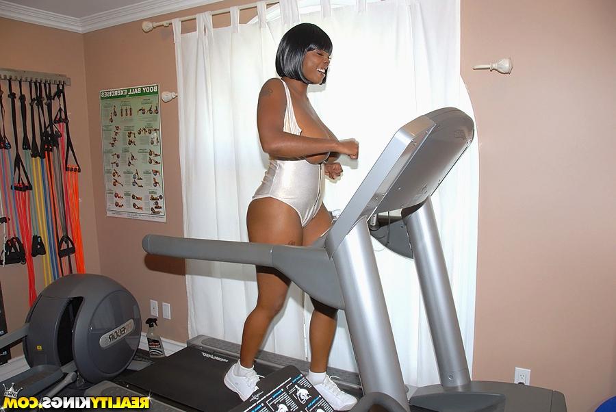 16P Lovesome black MILF Stacy Adams exposing huge tits in the gym