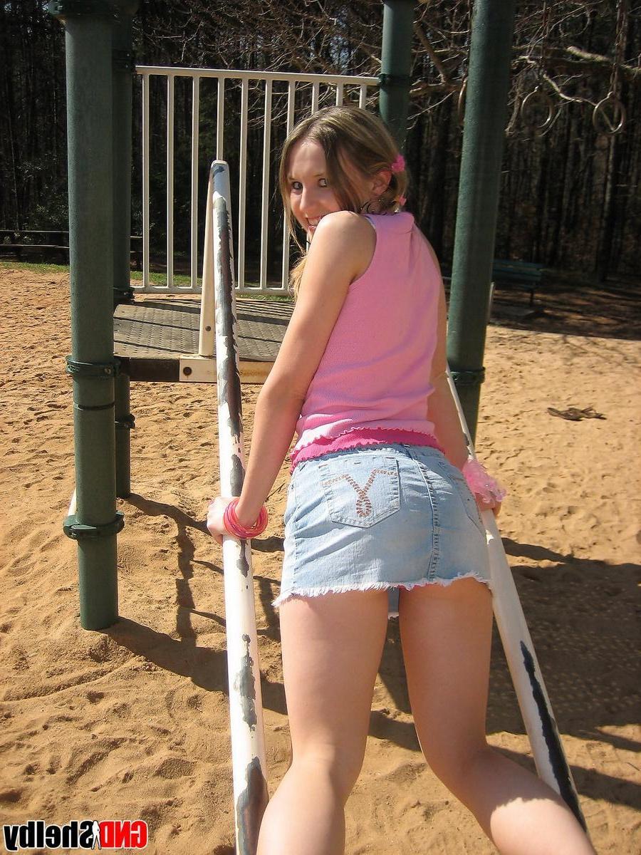 12P Petite teen Shelby isnt shy as she flashes her pussy and shows off her tight ass at the playground