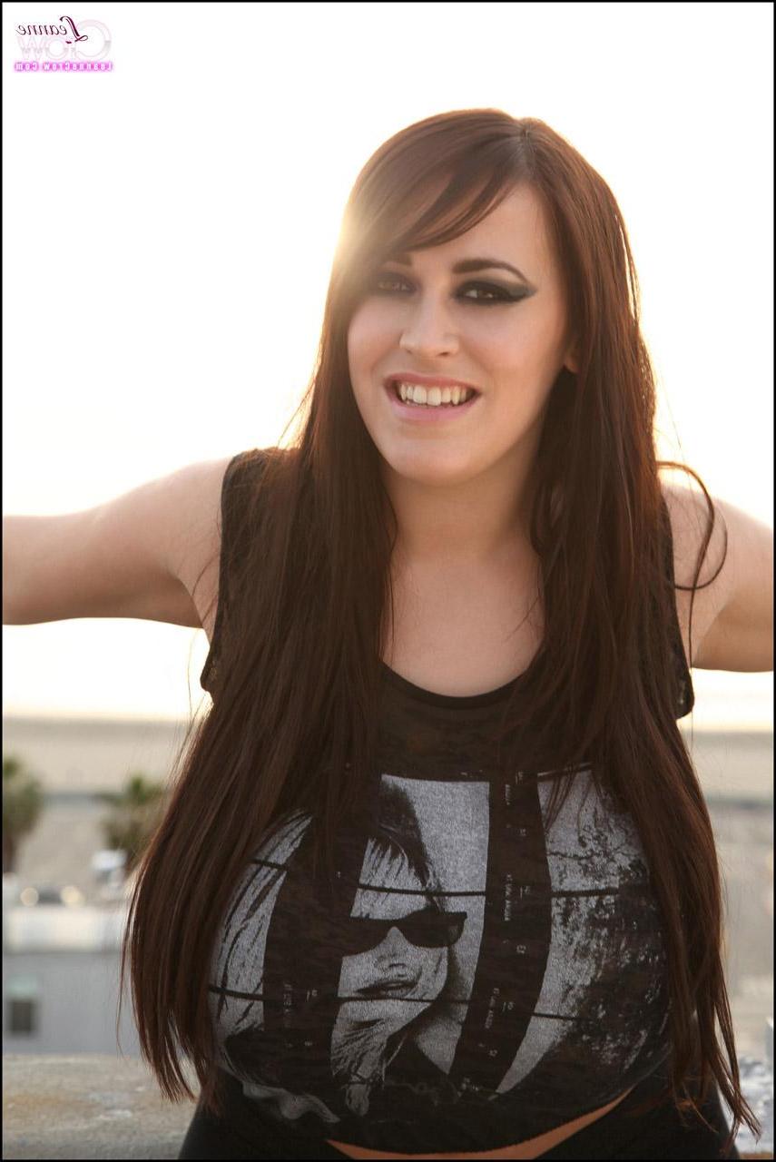 15P Busty babe Leanne Crow lets her boobs hang out on the roof top