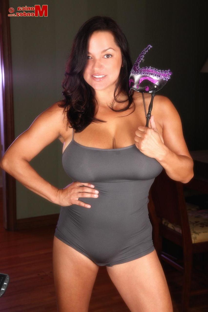 15P Busty latina Monica Mendez shows off her big boobs with a mask