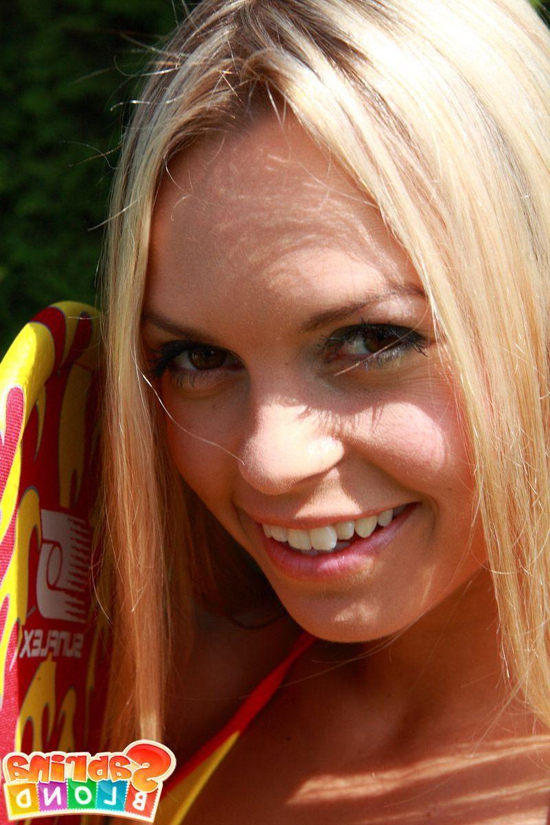 15P Pictures of Sabrina Blond masturbating on the grass