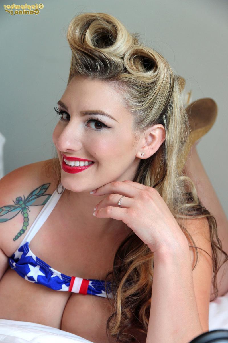 15P Busty pinup babe September Carrino falls out fo her American flag bikini