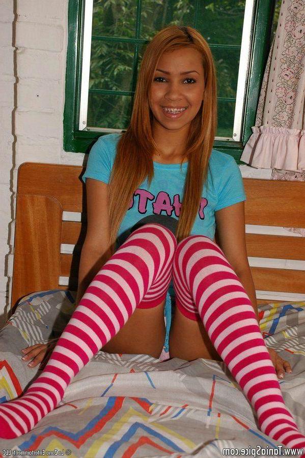 15P Pictures of Tania Spice wearing striped socks because sex is better that way