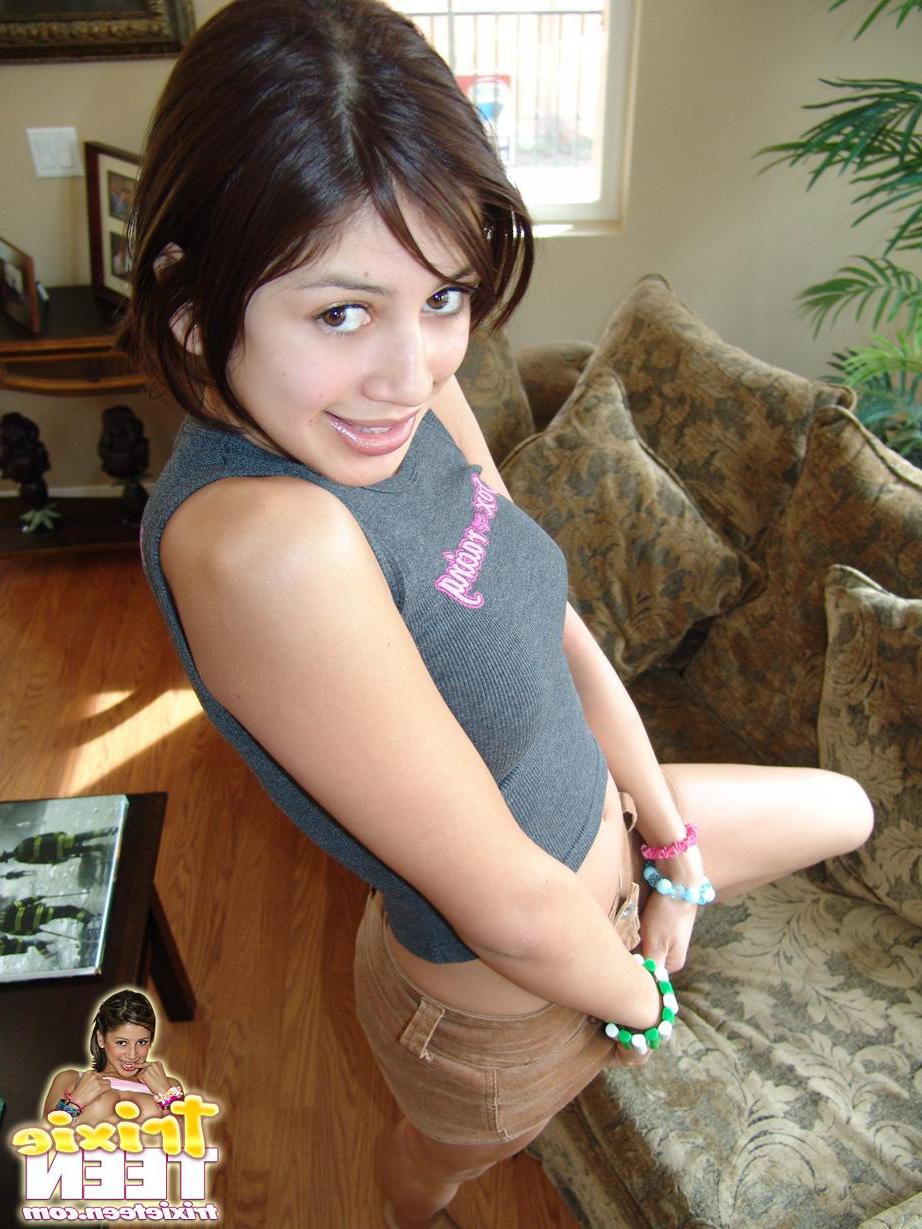 17P Trixie Teen takes off her shirt to show you her boobs