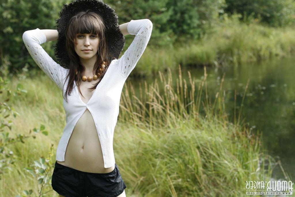 20P Brunette model Lena strips naked for you by the river