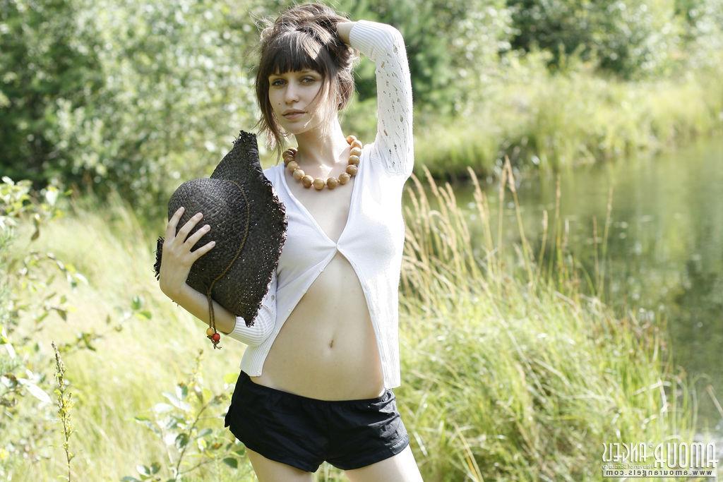 20P Brunette model Lena strips naked for you by the river