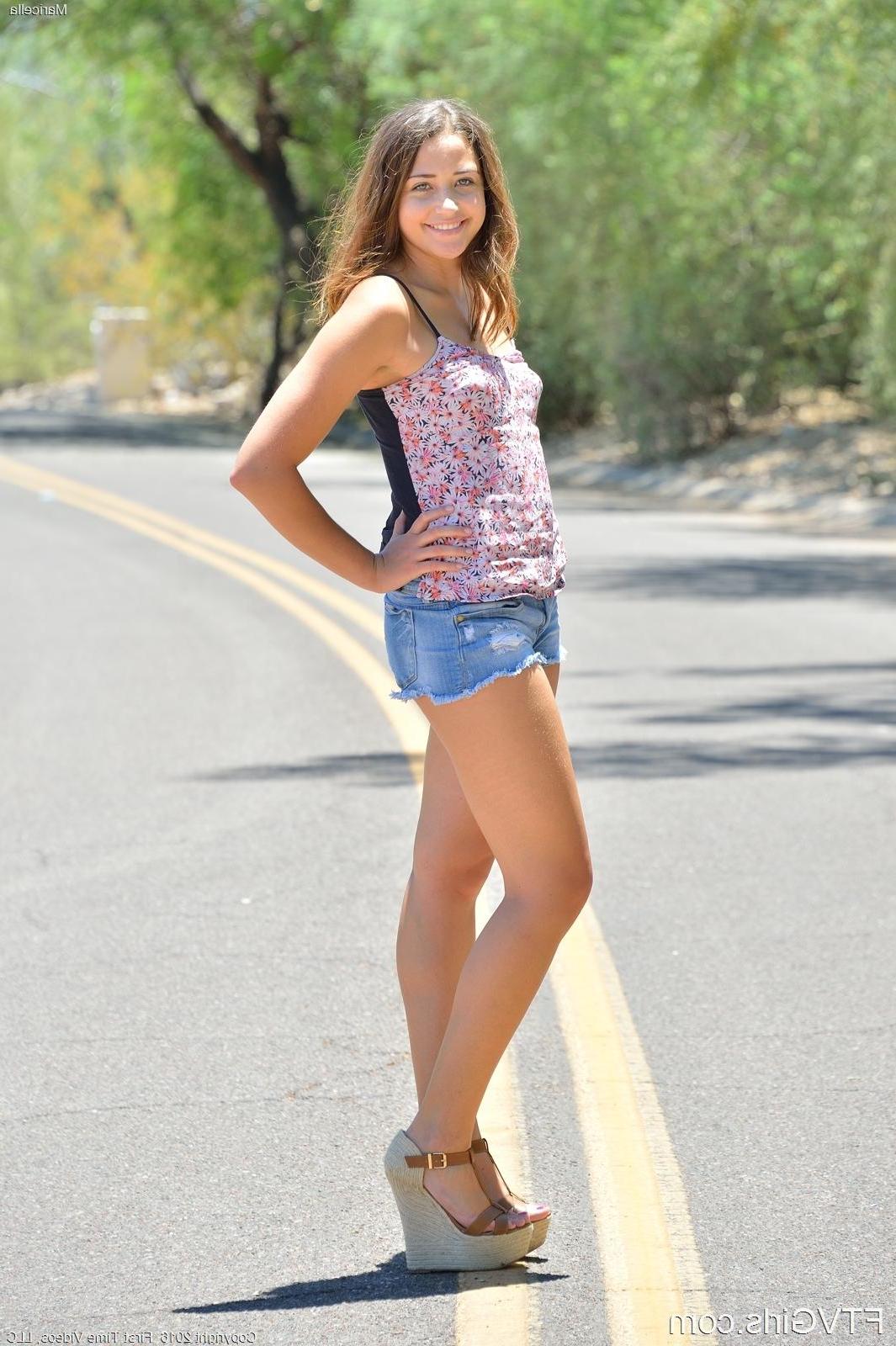 15P Brunette Maricella teases with her long legs while masturbating