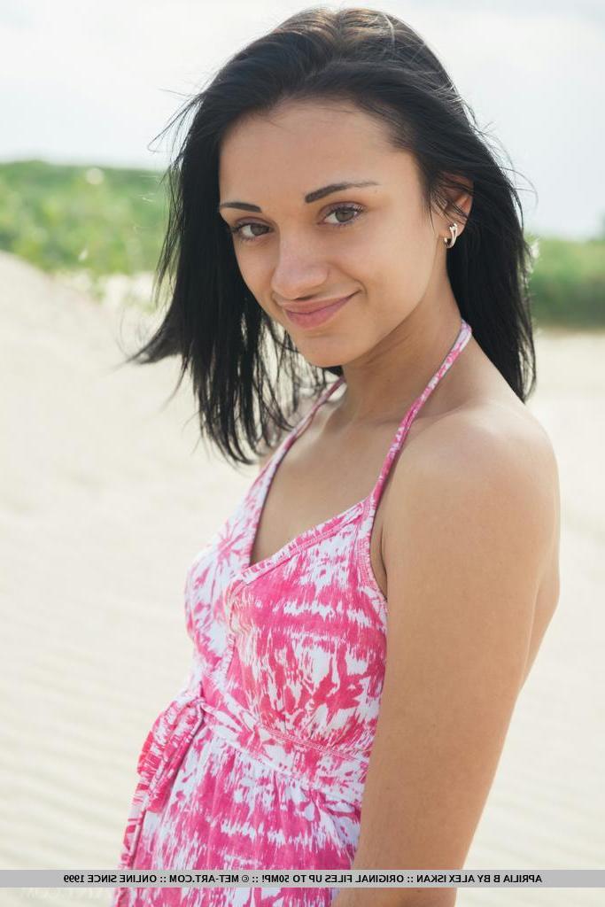 18P Brunette beauty Aprilia B strips naked for you on a beach
