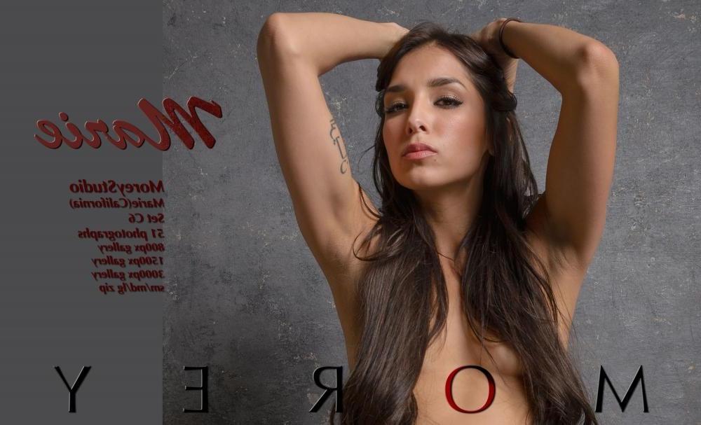 11P Brunette girl Marie displays her beautiful nude body in the studio