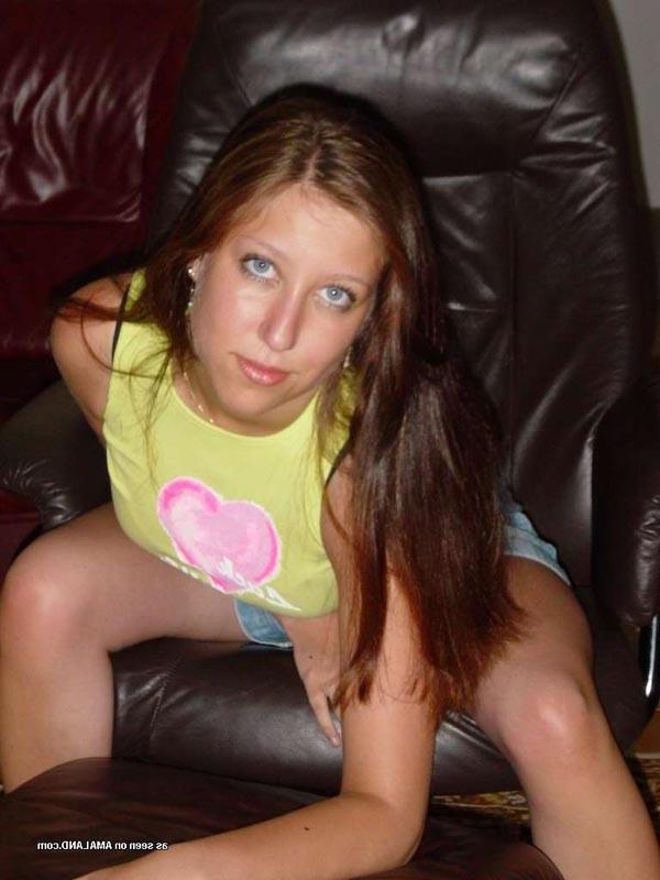 15P Sexy brunette cutie wearing a mini skirt posing in the garden