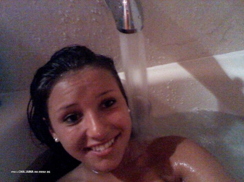15P Brunette hottie showing off her smoothly shaven snatch