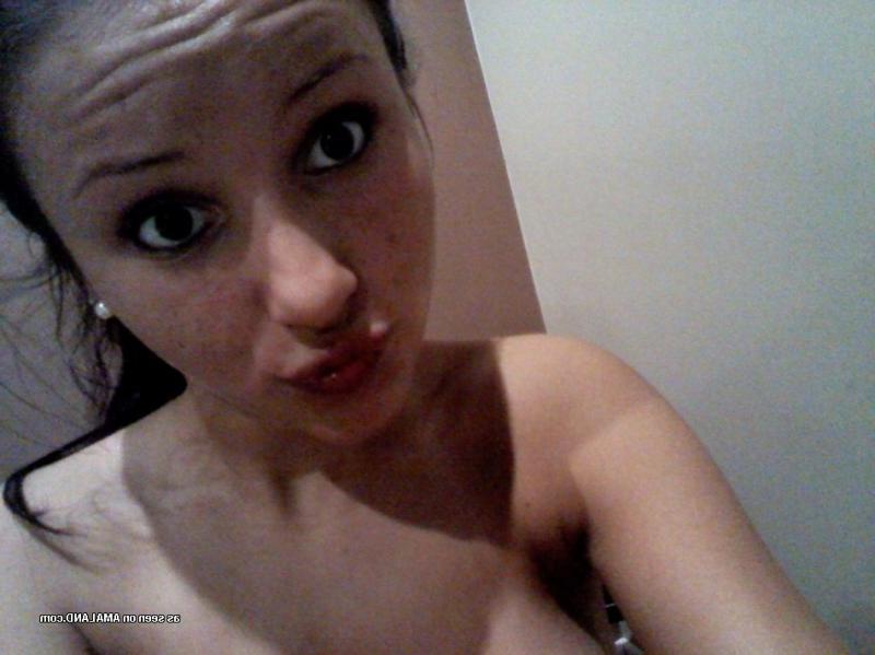 15P Brunette hottie showing off her smoothly shaven snatch