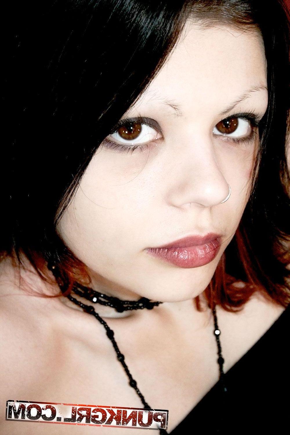 15P Pictures of goth teen Lori showing off in boots